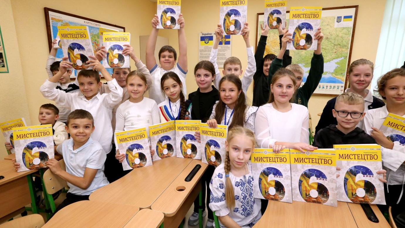 Children presenting the books in class. The text books were delivered to Poltava in Ukraine in October